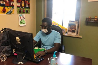 uss student felxi with mask working at a desk